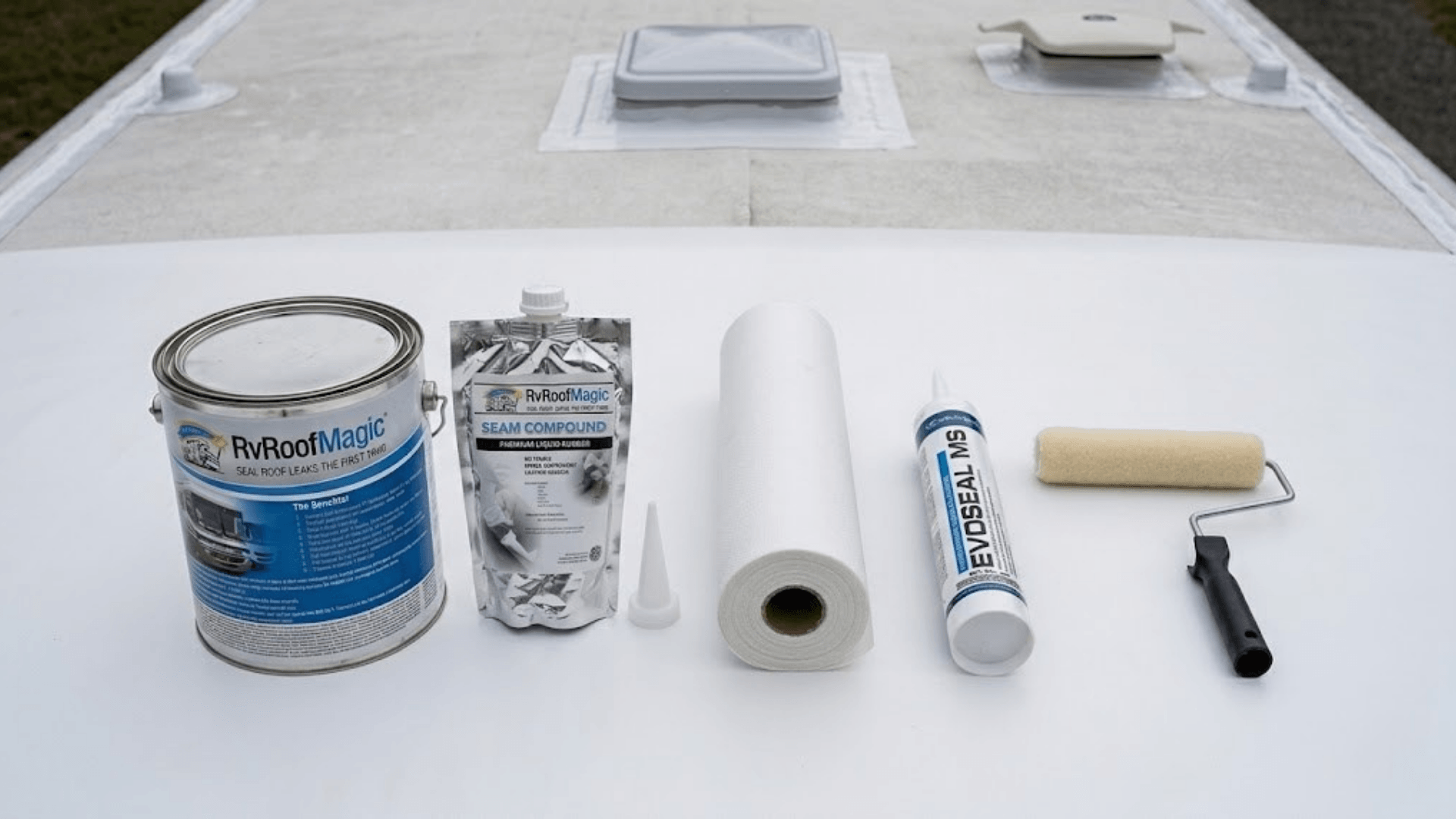 A neat layout of RV roof repair products: RV Roof Magic, Seam Tight, Poly Fabric, Butyl MS Caulk, and a roller brush.